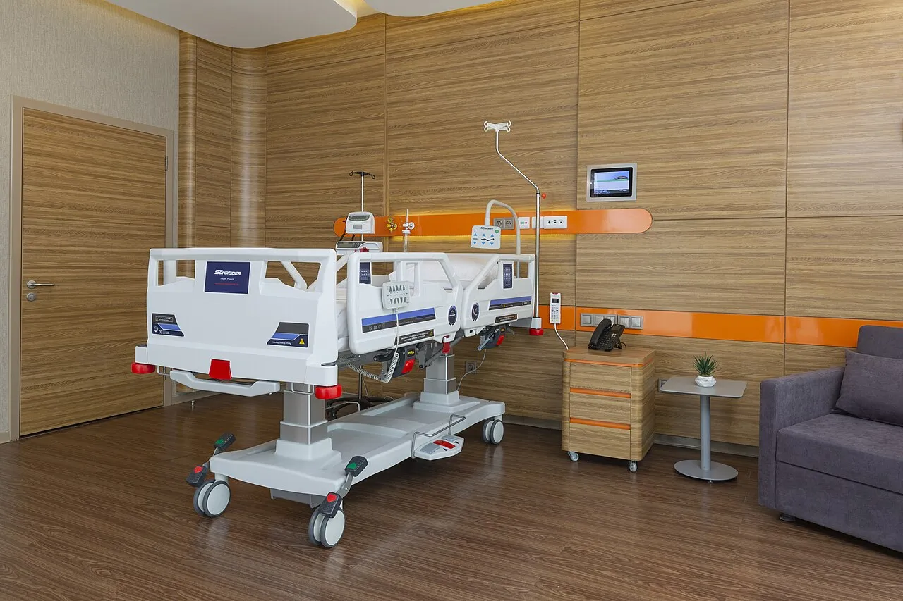 Modern electric hospital bed in a patient room